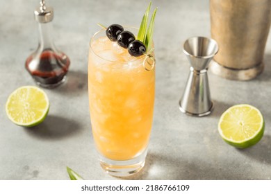 Cold Refreshing Three Dots and a Dash Cocktail with Rum and Pineapple