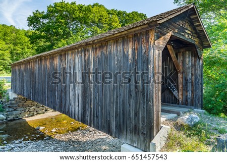 The Cold River Bridge, also known as McDermott Bridge, is a historic wooden covered bridge over the Cold River in Langdon, New Hampshire.