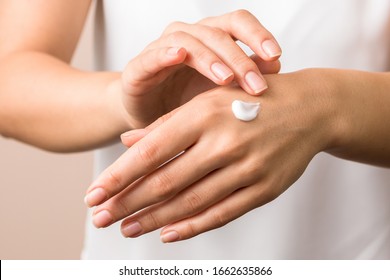 Cold Season Hands Skin Protection. Closeup Woman Applying Protective Cream On Hands.