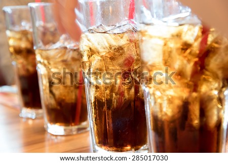 Cold soda iced drink in a glasses - Selective focus, shallow DOF