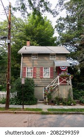 Cold Spring, New York USA - July 20 2021: Charming Old Wood Neighborhood Home With Shutters And Green Trees In Cold Spring New York