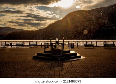 Cold Spring, NY - USA - Feb 10, 2022 Horizontal Sunset View Of Cold Spring Pier Overlooking The Frozen Hudson River. Located In Cold Spring A Village In Philipstown Putnam County, New York