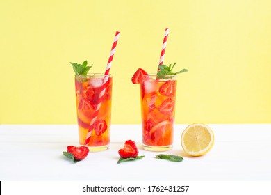 Cold Strawberry Lemonade Juice With Ice Cubes, Lemon And Mint. Summer Refreshing Cocktail.