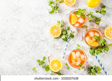 Cold Summer Drink. Iced Tea With Lemon And Mint, On Grey Stone Background.  Copy Space  Top View