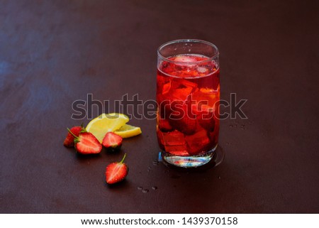 Cold summer drink. Sparkling glasses with berry cocktail.