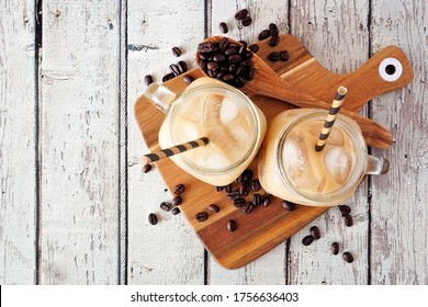 Cold Summer Iced Coffee On A Serving Board. Top View Over A Rustic White Wood Background.