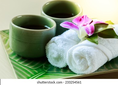 Cold Towel And Tea Cup On The Tray At Spa Area