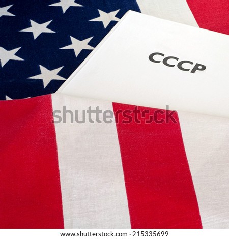 cold war  USA and USSR, CCCP written on the book, flag baground