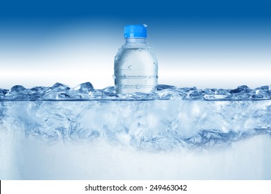 Cold Water Bottle In Ice Bucket With Ice Cubes