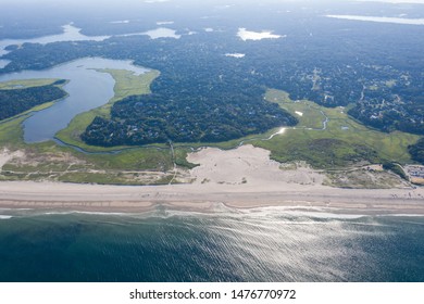 The Cold Waters Of The Atlantic Ocean Wash Onto A Beach In Orleans, Cape Cod, Massachusetts. This Beautiful Area Of New England, Not Too Far From Boston, Is A Popular Summer Vacation Destination.