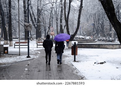 Cold weather. Unidentified people walk on the street in Botosani, Romania