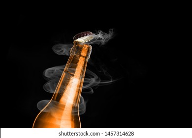 Cold Wet Bottle Of Chilled Drink With Drops Close Up. Opening Of Beer Cap With The Gas Output.