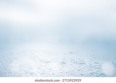 COLD WINTER BACKGROUND WITH EMPTY ICE FIELD, BOKEH AND WHITE FROSTY SKY, BACKDROP FOR CHRISTMAS MONTAGE, FRESH FROSTED NATURE STILL LIFE PATTERN