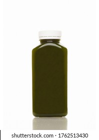 Cold-pressed spinach juice for detoxification against a white background. Juice made of organic fruits and vegetables. Clean nutrition, weight loss, healthy eating concept. Detox. Detoxification.