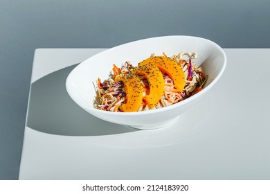 Cole Slow Salad With Mango And Poppy Seeds On Light Background. Hard Light, Deep Shadow.