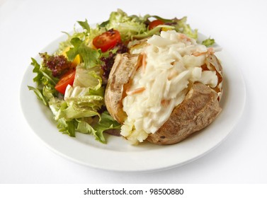 A Coleslaw Baked Potato On A Plate With Side Salad