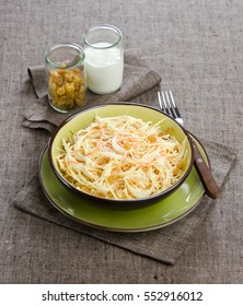 Coleslaw With Raisins In A Green Plate On A Brown Background