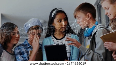 Collaborating five students gathering around tablet in school corridor, with face recognition. Collaboration, education, technology, innovation, youth, teamwork, learning