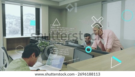 Collaborating software developers reviewing code in open-plan office, with monitors and laptop. Collaboration, teamwork, modernoffice, technology, innovation, productivity, professional