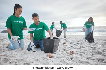 Collaboration, charity and recycling with people on beach for sustainability, environment and eco friendly. Climate change, earth day and nature with volunteer and box for help, energy and pollution - Powered by Shutterstock