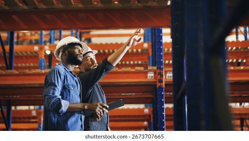 Collaboration, pointing and tablet with construction worker men in warehouse for inspection. App, engineering and security with developer team in depot for maintenance, planning or project management