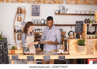 Collaboration, small business shop and tablet with owner in coffee shop together for planning or service. Teamwork, technology for ecommerce or online order with man and woman in cafe or restaurant - Powered by Shutterstock