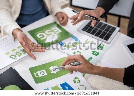 Collaborative design session on eco-friendly branding strategies office workspace digital content creative environment high angle view sustainability focus