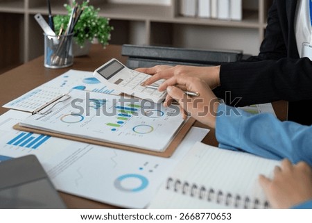Collaborative financial planning session with advisor in office