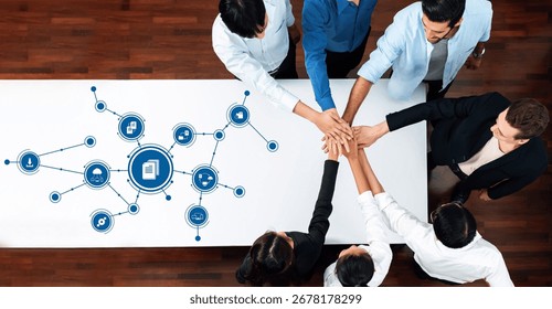 Collaborative Management Techniques Illustrated by Hands Joining Over a Table with Technology Icons Representing Teamwork and Innovation Strategies. Amity