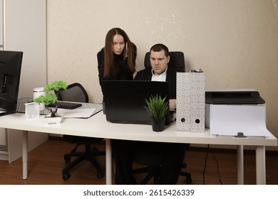 Collaborative Office Environment Featuring Professionals Analyzing Business Reports