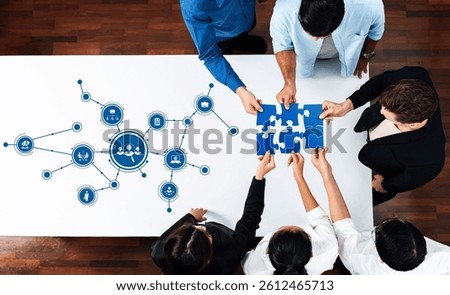 Collaborative Teamwork Over Puzzle Pieces and Digital Connections, Representing Data Analysis, Problem Solving, and Effective Communication Skills in Business. Amity