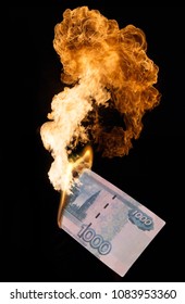 Collage with burning thousand-ruble note and big flame on black background