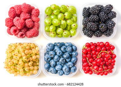 Collage Of Different Fruits And Berries Isolated On White. Blueberries, Cherries, Blackberries, Grapes, Strawberries, Currants. Collection Of Fruits And Berries In A Bowl. Top View.