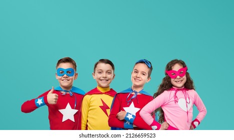 Collage Of Group Of Cheerful Kids In Vivid Colorful Superhero Costumes Looking At Camera Against Blue Background In Studio