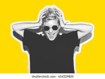 Collage In Magazine Style With Colorful Emotional Fashion Short Hair Blonde. Crazy Girl In Black T-shirt And Rock Sunglasses Scream Holding Her Head. Rocky Woman White Toned Yellow Background