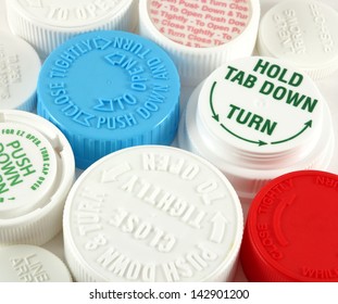 Collage Of Medicine Bottle Safety Caps On A White Background