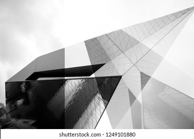 Collage of modern architecture fragments with angular structure. Transparent and matte wall panels. Abstract black and white architectural background with geometric shapes.