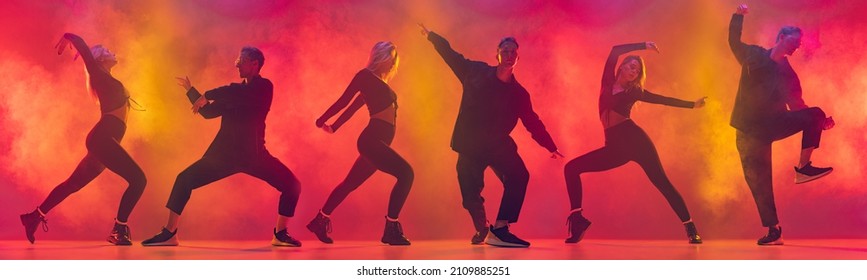 Collage. Street Dancer. Two Hip-hop Dancers In Motion Isolated Over Gradient Pink Yellow Background In Neon Light. Youth Culture. Concept Of Dance, Youth, Hobby, Dynamics, Movement, Action, Ad