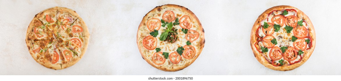 Collage of three pizzas with different fillings and olives on a light background, top view with a copy space for the text. A long panorama of photos. - Powered by Shutterstock