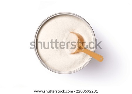 Collagen powder or milk powder in can with spoon isolated on white background with clipping path, top view, flat lay.