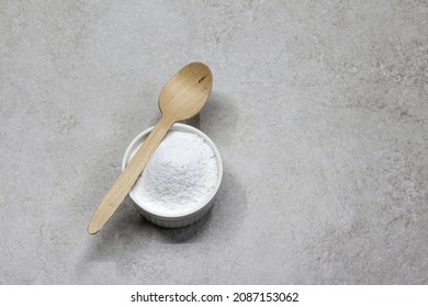 Collagen powder on grey beton background. Natural health supplement for skin
