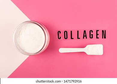 Collagen powder on pink background. Extra protein intake. Natural beauty and health supplement for skin, bones, joints and gut. Plant or fish based. Flatlay, top view. Copy space text.