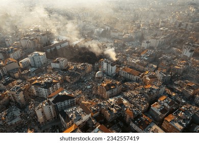 Collapsed buildings after an earthquake in a city.Search and rescue teams and paramedics rescue the victims among the debris and rubble destroyed by the earthquake. Ruins destruction tragedy disaster.