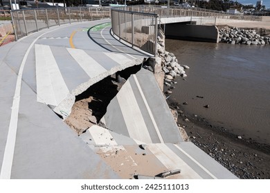 Collapsed concrete blocking beach bike path bridge.  Damage is from winter storm in the Pacific Palisades neighborhood of Los Angeles, California.