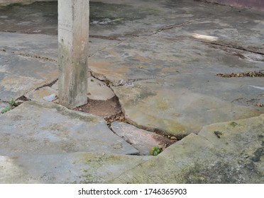 Collapsed Or Cracked Concrete Basement Floor And Pole