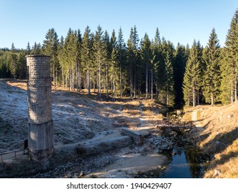 Collapsed Dam Intake Tower In The Forest