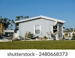 Collapsed and damaged mobile homes after hurricane swept through Florida residential area. Consequences of severe natural disaster