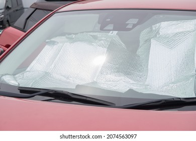 Collapsed Sun Shade Or Sun Reflector On The Windshield The Car