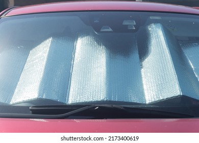 Collapsed Sun Shade Or Sun Reflector On The Windshield The Car