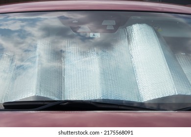 Collapsed Sun Shade Or Sun Reflector On The Windshield The Car